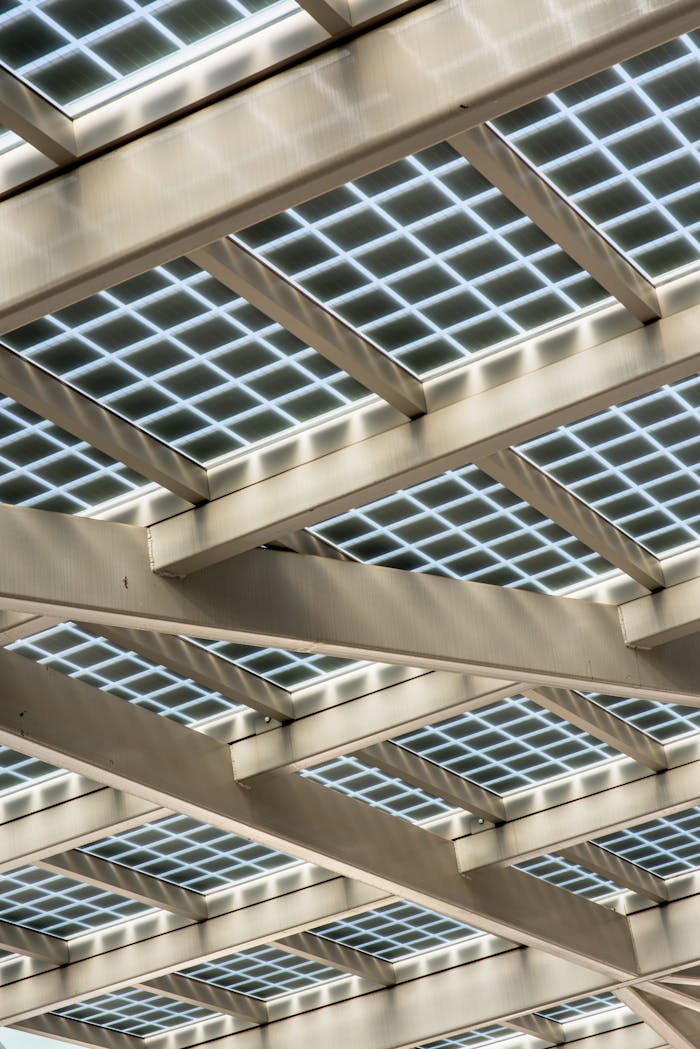 mobile-01 Abstract view of a modern solar panel structure with geometric patterns.